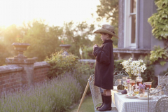 young boy [7-8] standing on chair by dining table outside/pv_13.tif